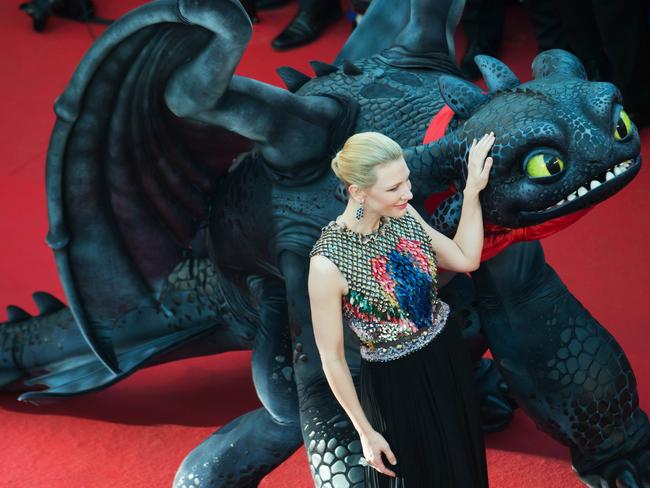 Centre of attention ... Cate Blanchett poses her dragon co-star Krokmou on the Cannes Film Festival red carpet. Picture: Bertrand Langlois