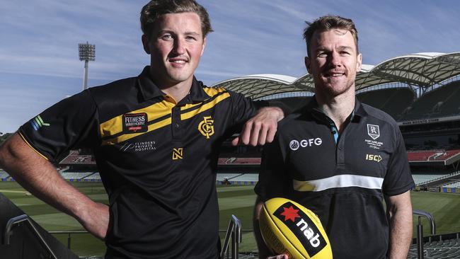 Port Adelaide champion Robbie Gray (right) and draft hopeful Glenelg's Will Gould at Adelaide Oval ahead of the NAB AFL Draft. Picture SARAH REED