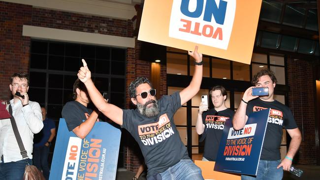 A man who identified himself as Ceasar (centre, pictured next to former Young LNP member Barclay McGain on the right) confronts protesters. Picture: NCA NewsWire / John Gass