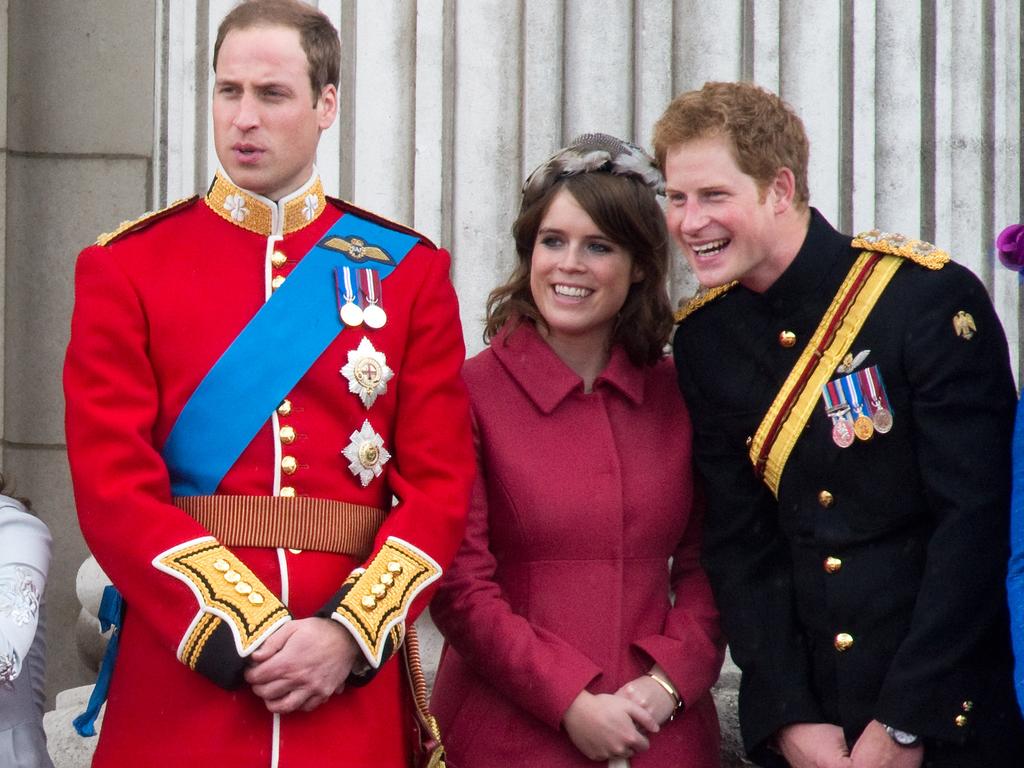 Prince Harry with Princess Eugenie and Prince William on the balcony of Buckingham Palace in 2012 has always been close to his cousin. Picture: Anwar Hussein/WireImage