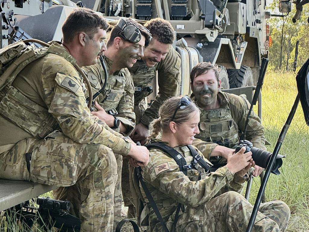 3rd Brigade Public Affairs Cell Trooper Dana Millington showing soldiers photos during an exercise