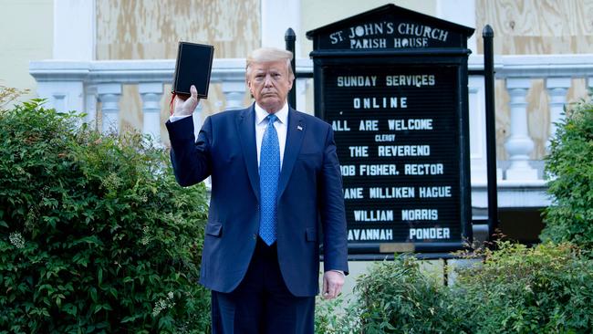 US President Donald Trump holds a Bible while visiting St John's Church. Picture: AFP