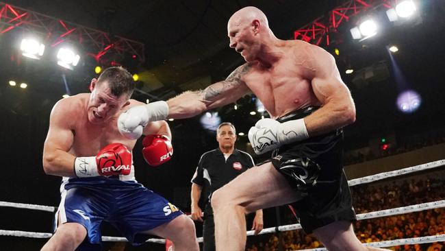 Barry Hall tags Paul Gallen with a right. Picture: AAP