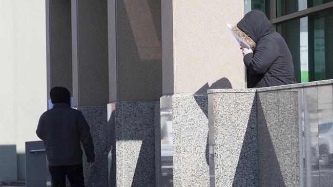 Fahed Elniz with his wife Tracy leave the Hobart Magistrates Court in June this year.