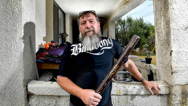Kym Abrook, pictured with his trusty didgeridoo at his western suburbs home. Picture: AAP Image/Sam Wundke