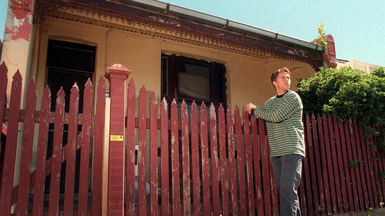 Greg Armstrong stands in front of the house in Easey Street, Collingwood, where his mother, Suzanne Armstrong, was killed, alongside Susan Bartlett in 1977.