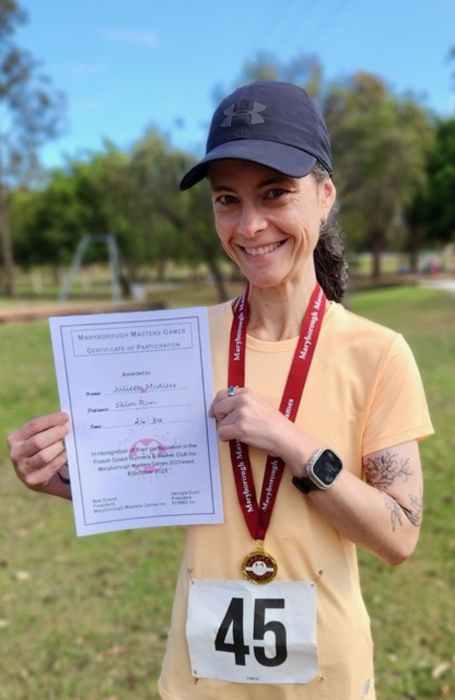 Juliette McAleer running the Bridge to Brisbane connected to her tube feeds with a pump in her running vest.