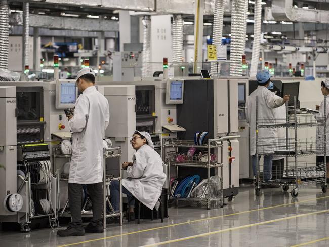 Workers are seen on the production line at Huawei's production campus near Shenzhen, China. Picture: Getty