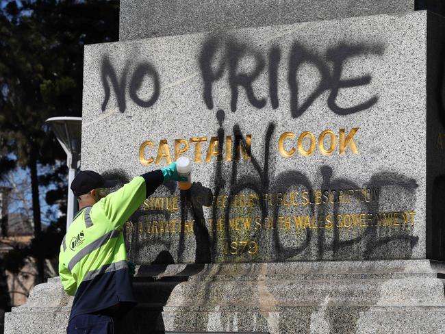 Council workers cleaned the statues which were defaced today. Picture: David Swift