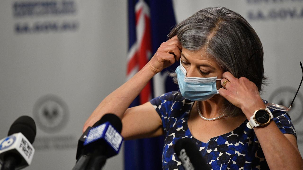 South Australian Chief public health officer Nicola Spurrier putting on a mask during the lockdown announcement. Picture: NCA NewsWire / David Mariuz