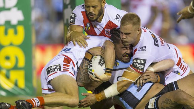 Cronulla’s Andrew Fifita is held up over the line by some determined Dragons defence at Southern Cross Group Stadium. Picture: AAP