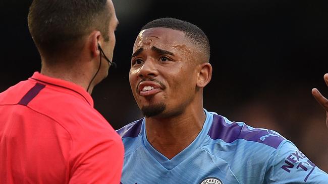 Manchester City's Brazilian striker Gabriel Jesus (R) remonstrates with English referee Michael Oliver after his goal was dissallowed following a VAR decision during the English Premier League football match between Manchester City and Tottenham Hotspur at the Etihad Stadium in Manchester, north west England, on August 17, 2019. - The match ended in a draw at 2-2. (Photo by Oli SCARFF / AFP) / RESTRICTED TO EDITORIAL USE. No use with unauthorized audio, video, data, fixture lists, club/league logos or 'live' services. Online in-match use limited to 120 images. An additional 40 images may be used in extra time. No video emulation. Social media in-match use limited to 120 images. An additional 40 images may be used in extra time. No use in betting publications, games or single club/league/player publications. /