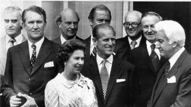 Royal visit and tour of Australia by Queen Elizabeth II and the Duke of Edinburgh. The Queen and Prince Philip pose at Privy Council meeting, outside Parliament House in Canberra, 1977. (L-R) Billy Snedden, Prime Minister Malcolm Fraser, Sir Harry Gibbs, the Queen and Duke, Phillip Lynch, Sir Martin Charteris, the Queen’s private secretary, Sir Charles Adermann and Sir John Kerr.