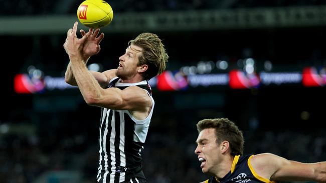 Tom Jonas beats Riley Thilthorpe to the footy. Picture: James Elsby/AFL Photos via Getty Images