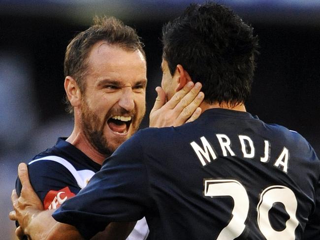 Melbourne Victory v Sydney United at Etihad Stadium. Victory's Nik Mrdja kicks the teams first goal and cops a hug from Grant Brebner.