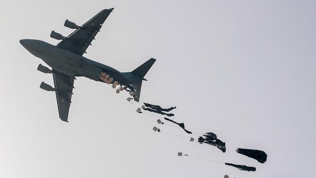 A United Arab Emirates Air Force C-17 Globemaster III drops aid packages on the northern Gaza Strip on Tuesday. Picture: AFP