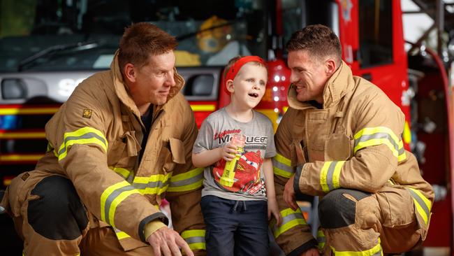 Alex Withers and Brad Burch with Alex Tann at the Golden Grove Fire Station in 2018. Picture: Matt Turner