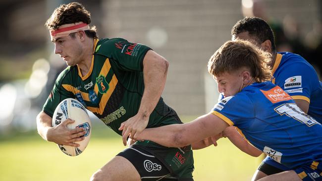 Jack Leigh grabs Mittagong fullback James Coyne. Pics by Julian Andrews.