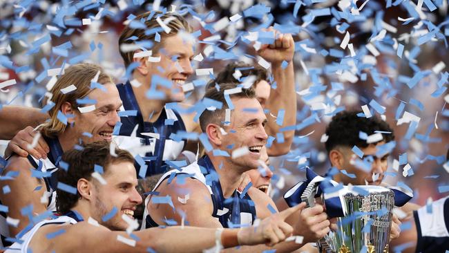 Joel Selwood of the Geelong Cats and his team celebrate with the trophy after in victory during the 2022 AFL Grand Final match. Picture: Getty