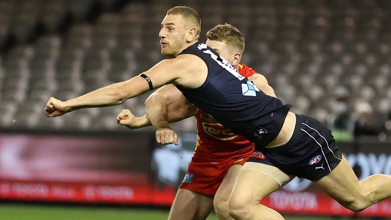 Liam Jones punches the ball clear of his Gold Coast opponent. The tall defender has enjoyed a strong year. Picture: Getty Images