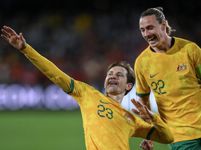 Craig Goodwin (23) celebrates with teammate Jackson Irvine after scoring for the Socceroos against China in Adelaide. Picture: Mark Brake/Getty Images