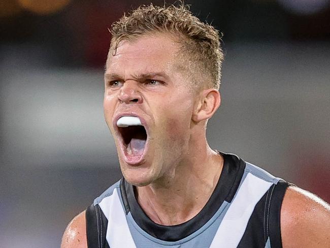 BRISBANE, AUSTRALIA - MARCH 19: Dan Houston of the Power celebrates a goal during the 2022 AFL Round 01 match between the Brisbane Lions and the Port Adelaide Power at The Gabba on March 19, 2022 In Brisbane, Australia. (Photo by Russell Freeman/AFL Photos)