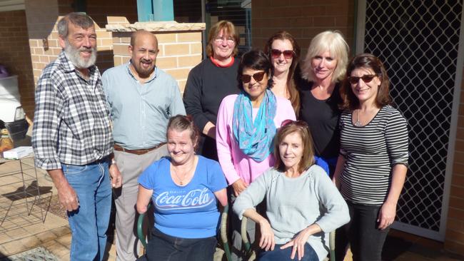 Jodi (third from left) was born with only partial arms and one leg. Staff from St John Paul II Catholic College visited Jodie in Richmond as part of DoSomething! Day. From left: Michael Greenaway, Andrew Noney, Janet Hammond, Fay Lovett, Karen Smith, Jodi Thomas, Josette Woolley, Jodie and Georgia Fitzgerald. Picture: Supplied