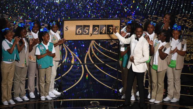 Chris Rock presents the amount of money collected by the Girl Scouts during the Oscars. Or was it? Picture: AFP