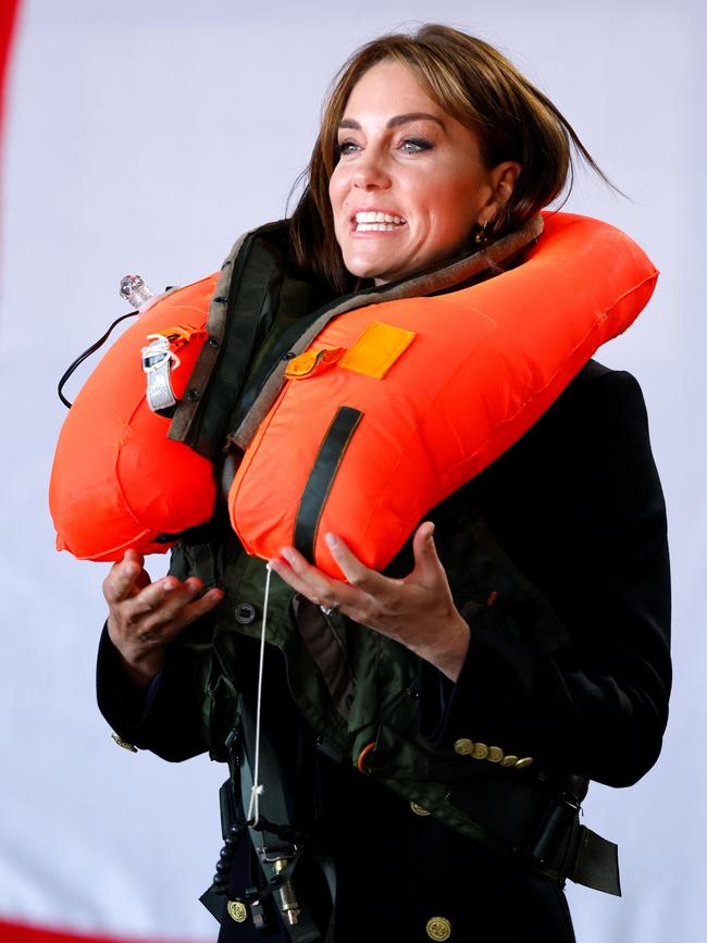 Kate reacts as she inflates an emergency life jacket. Picture: Max Mumby/Indigo/Getty Images