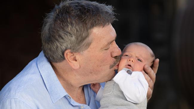 Brian Taylor and his new baby grandson Noah. Picture: Jason Edwards