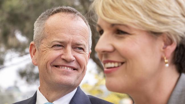 Opposition Leader Bill Shorten looks on as Deputy Opposition Leader Tanya Plibersek speaks at a Melbourne primary school.