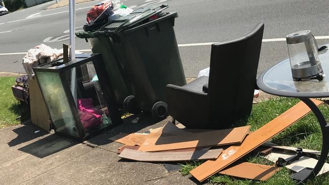 Rubbish including couches, broken glass, pieces of wood and broken furniture dumped at Kumbari Street in Southport.