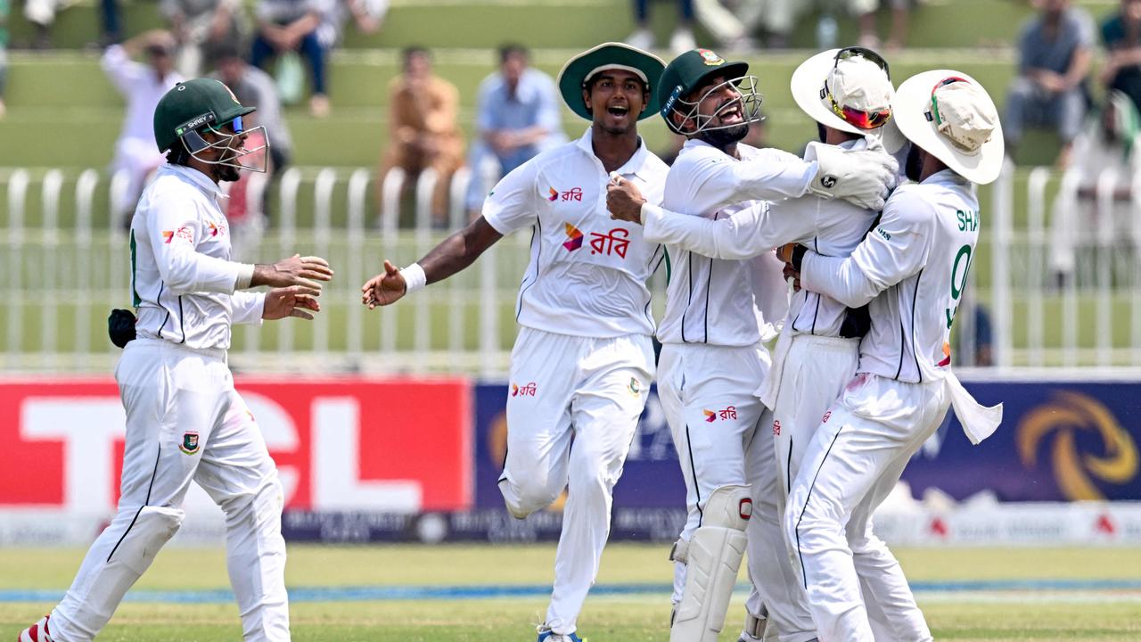 Bangladesh's players celebrate after the dismissal of Pakistan's Agha Salman (not pictured)) during the fifth and final day of the first Test cricket match between Pakistan and Bangladesh at the Rawalpindi Cricket Stadium in Rawalpindi on August 25, 2024. (Photo by Farooq NAEEM / AFP)