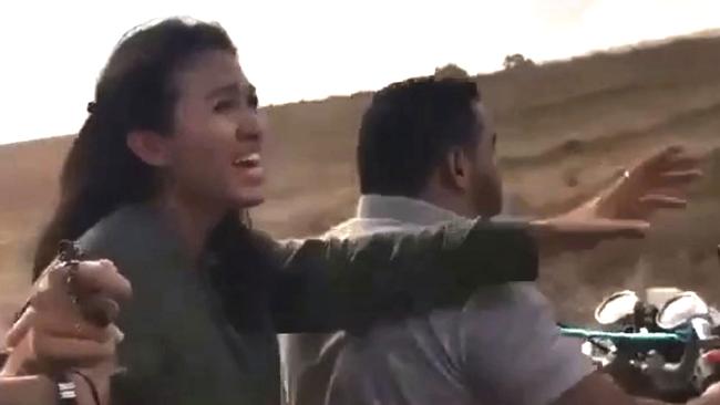 In a still taken from video, a woman that has been identified on social media as Noa Argamani, is pictured being abducted by Palestinian militants in Southern Israel.