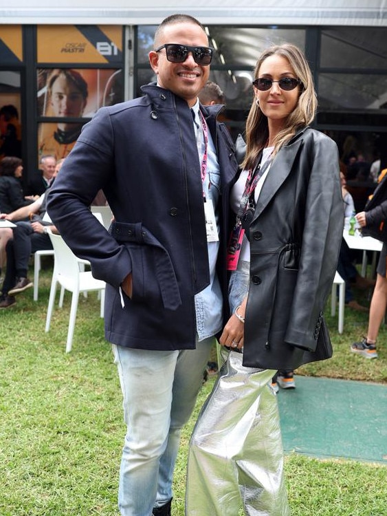 Usman Khawaja and Rachel Khawaja pose for a photo in the paddock prior to the F1 Grand Prix in Melbourne (Photo by Robert Cianflone/Getty Images)