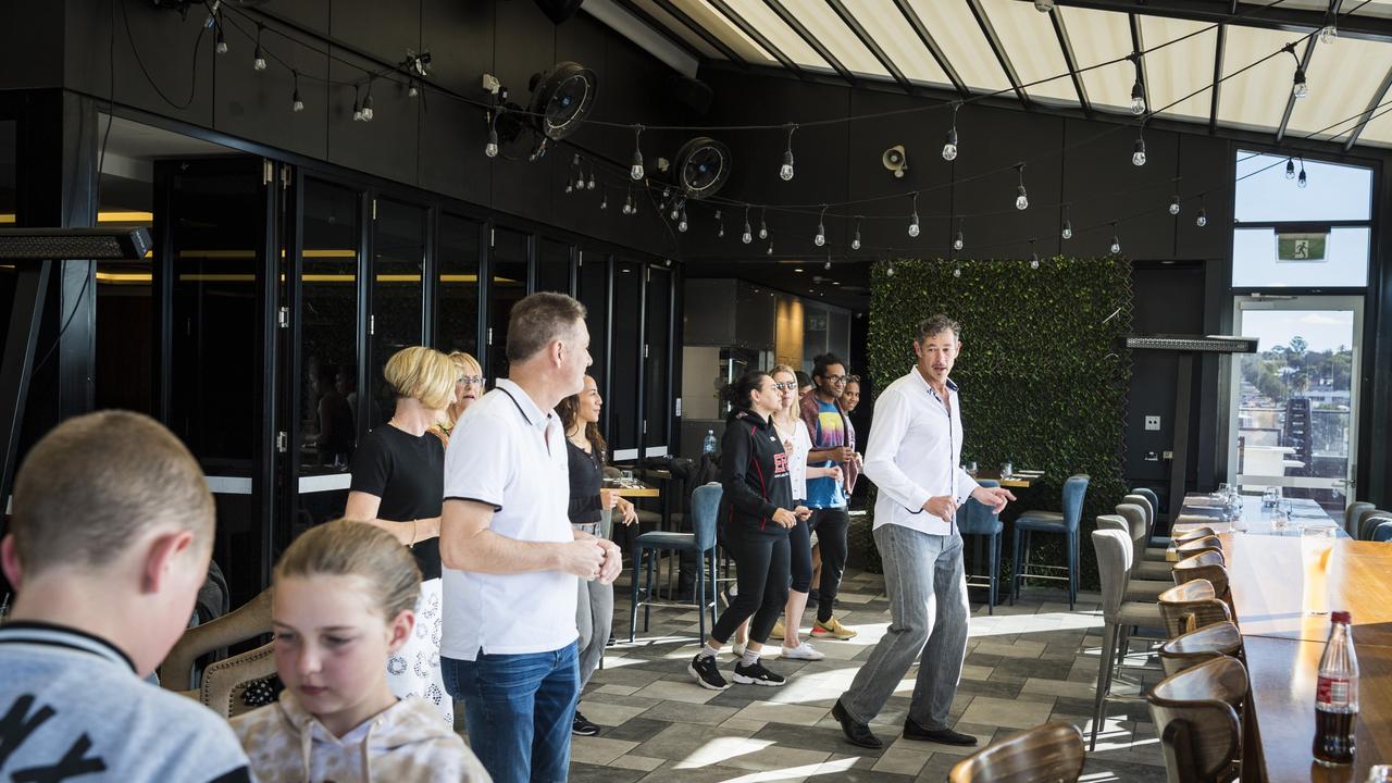 Richard Tomlinson (right) shows the steps as Street Salsa Toowoomba hosts Sunday Arvo Street Salsa at George Banks, Sunday, June 20, 2021. Picture: Kevin Farmer