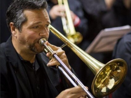 Layne Visser, a music teacher at Barrenjoey High, playing the trombone with the Big Village Band. Picture: Facebook.