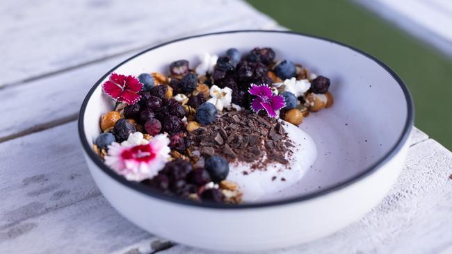 The house-made toasted muesli with coconut yoghurt and blueberries. Picture: David Kelly.