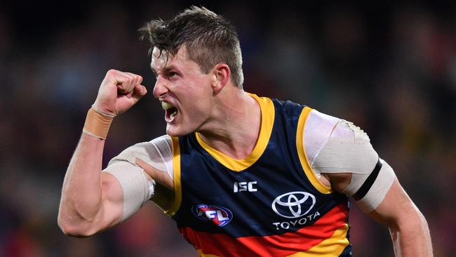 Adelaide’s Matt Crouch celebrates a goal last season.