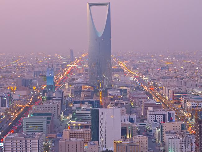 Riyadh, Saudi Arabia. the Kingdom tower is visible in the cityscape.