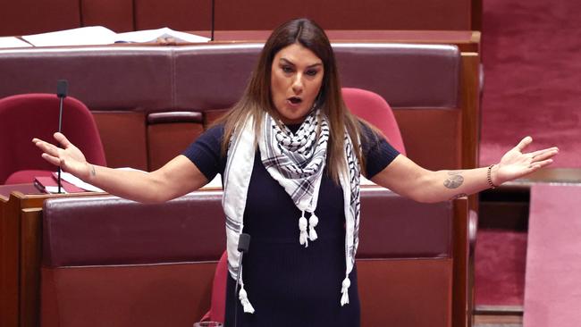 Australian Independent Senator Lidia Thorpe wears a Palestinian keffiyeh scarf as she speaks in the Senate chamber at Parliament House in Canberra.