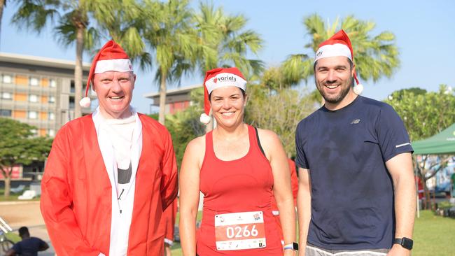 LR: Paul Kirby, Natasha Fyles and Brent Potter finishes the Variety Santa Fun Run. Picture: (A)manda Parkinson