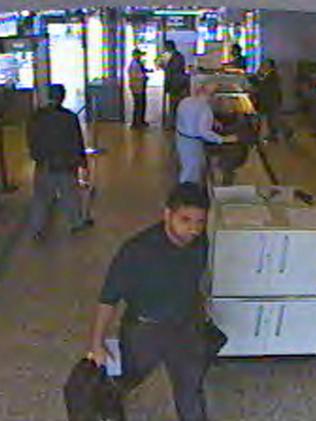 Hijacker Hani Hanjour, believed to have piloted American Airlines Flight 77 when it crashed into the Pentagon on September 11, 2001, is shown on surveillance video passing through the security checkpoint at Dulles International Airport.