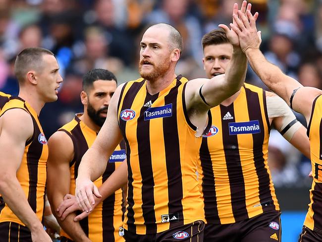 MELBOURNE, AUSTRALIA - APRIL 22: Jarryd Roughead of the Hawks is congratulated by team mates after kicking a goal during the round 5 AFL match between Hawthorn and Geelong at Melbourne Cricket Ground on April 22, 2019 in Melbourne, Australia. (Photo by Quinn Rooney/Getty Images)