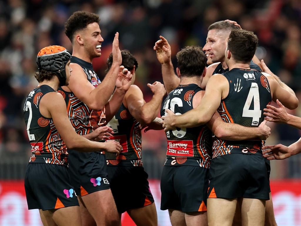 SYDNEY, AUSTRALIA - JULY 06: Jesse Hogan of the Giants celebrates kicking a goal with team mates during the round 17 AFL match between Greater Western Sydney Giants and Carlton Blues at ENGIE Stadium, on July 06, 2024, in Sydney, Australia. (Photo by Brendon Thorne/AFL Photos)