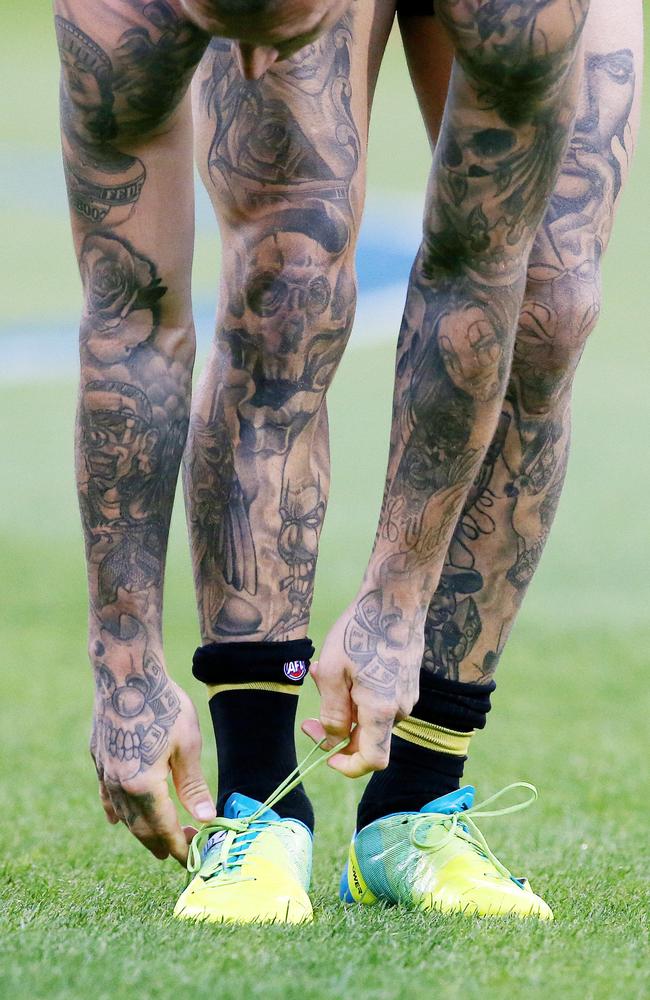 Richmond superstar Dustin Martin ties up his laces pre-match. Picture: Michael Klein