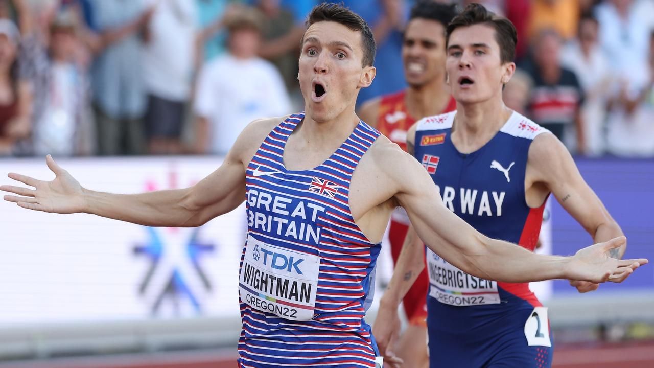 Jake Wightman of Team Great Britain and Jakob Ingebrigtsen of Team Norway cross the finish line in the Men's 1500m Fina.