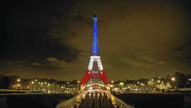 The Eiffel Tower is illuminated in the colours of the French flag in tribute to the victims of the November 13 terror attacks, in Paris, France. Picture: ETIENNE LAURENT