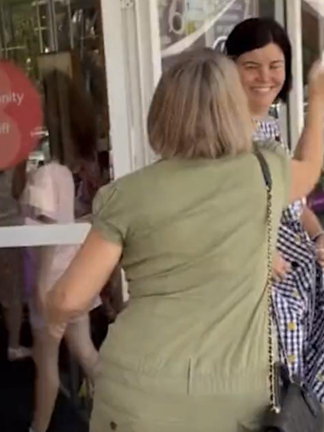 The woman approaches the NT Chief Minister.