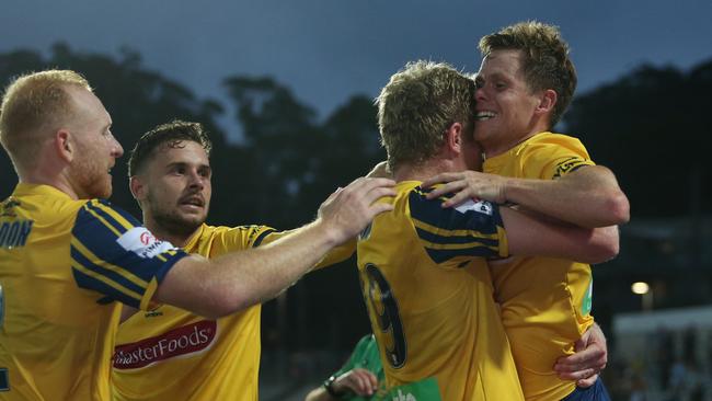 The Central Coast Mariners celebrating a goal against Melbourne Victory. Picture: Tony Feder/Getty Images